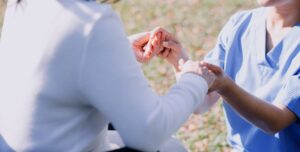 Chaplain services - chaplain and patient praying together. 