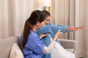 Therapist assisting patient with exercises.