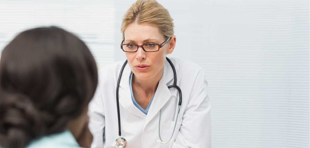 Photo of a doctor having a prognostic disclosure consultation with a patient in Houston, TX