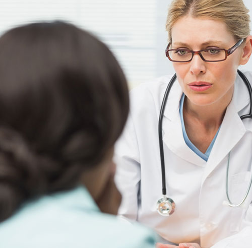 Photo of a doctor having a meeting with a hospice patient in Houston, TX, to discuss prognosis.
